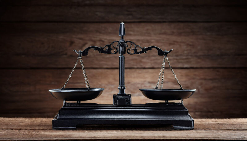 Balance scales clarifying listserv vs distribution list