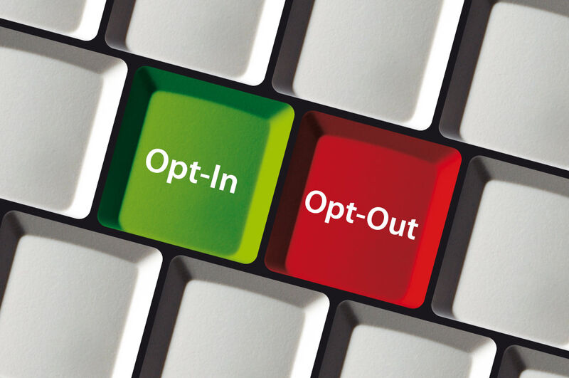An image showing a computer keyboard with opt-in and opt-our keys